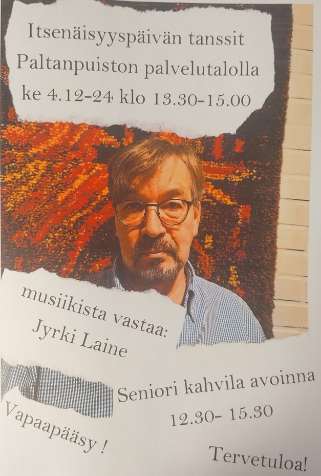 Jyrki Laine kuvattuna seinätekstiilin edessä.